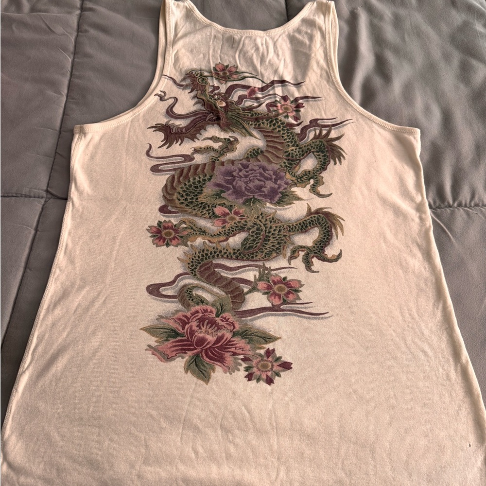 LUCKY BRAND VINTAGE RACERBACK TANK (please see photos) has a few tiny holes. Age